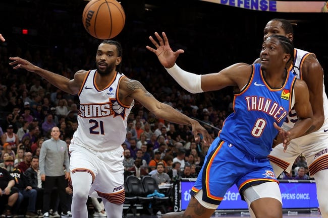 Nov 12, 2023; Phoenix, Arizona, USA; Oklahoma City Thunder forward Jalen Williams (8) gets the inbound ball against Phoenix Suns forward Keita Bates-Diop (21) and forward Kevin Durant (35) during the second quarter at Footprint Center. Mandatory Credit: Zachary BonDurant-USA TODAY Sports