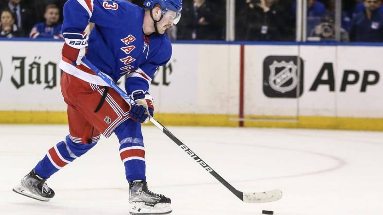 Nov 12, 2023; New York, New York, USA; New York Rangers left wing Alexis Lafreniere (13) scores the game winning goal in a shootout against the Columbus Blue Jackets at Madison Square Garden. Mandatory Credit: Wendell Cruz-USA TODAY Sports