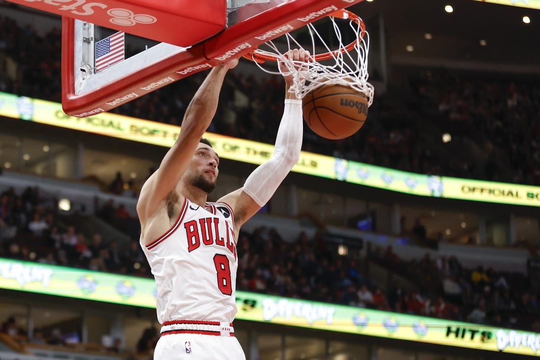 Nov 12, 2023; Chicago, Illinois, USA; Chicago Bulls guard Zach LaVine (8) scores against the Detroit Pistons during the second half at United Center. Mandatory Credit: Kamil Krzaczynski-USA TODAY Sports