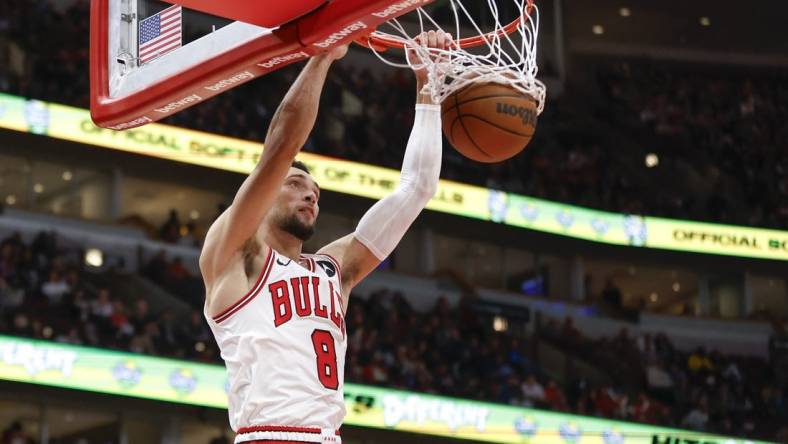 Nov 12, 2023; Chicago, Illinois, USA; Chicago Bulls guard Zach LaVine (8) scores against the Detroit Pistons during the second half at United Center. Mandatory Credit: Kamil Krzaczynski-USA TODAY Sports