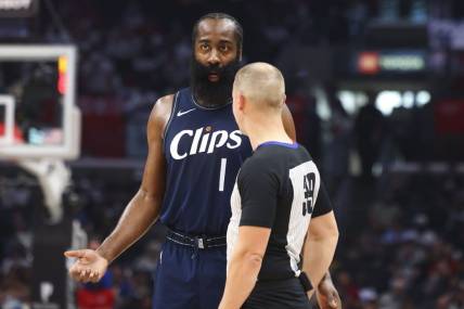 Nov 12, 2023; Los Angeles, California, USA; LA Clippers guard James Harden (1) speaks with the referee during the first half of a game against the Memphis Grizzlies at Crypto.com Arena. Mandatory Credit: Jessica Alcheh-USA TODAY Sports