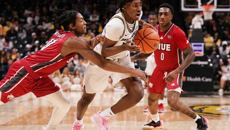 Nov 13, 2023; Columbia, Missouri, USA; Missouri Tigers guard Anthony Robinson II (14) dribbles the ball and is fouled by SIU Edwardsville Cougars guard Brian Taylor II (11) during the first half at Mizzou Arena. Mandatory Credit: Denny Medley-USA TODAY Sports