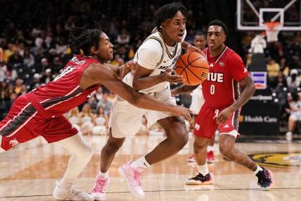 Nov 13, 2023; Columbia, Missouri, USA; Missouri Tigers guard Anthony Robinson II (14) dribbles the ball and is fouled by SIU Edwardsville Cougars guard Brian Taylor II (11) during the first half at Mizzou Arena. Mandatory Credit: Denny Medley-USA TODAY Sports