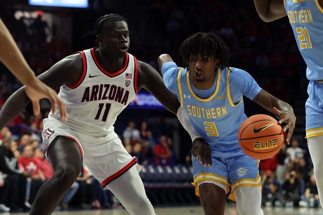 Nov 13, 2023; Tucson, Arizona, USA; Southern University Jaguars guard Tai'Reon Joseph (3) drives to the basket against Arizona Wildcats center Oumar Ballo (11) during the first half at McKale Center. Mandatory Credit: Zachary BonDurant-USA TODAY Sports