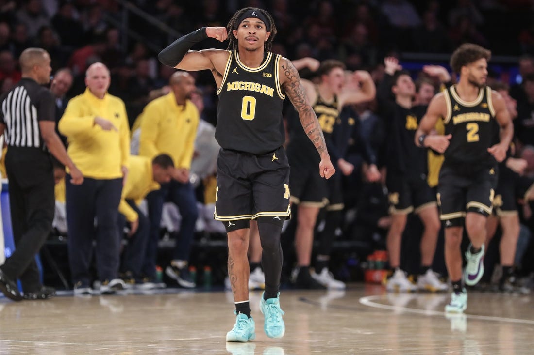 Nov 13, 2023; New York, New York, USA; Michigan Wolverines guard Dug McDaniel (0) celebrates in the second half against the St. John's Red Storm at Madison Square Garden. Mandatory Credit: Wendell Cruz-USA TODAY Sports