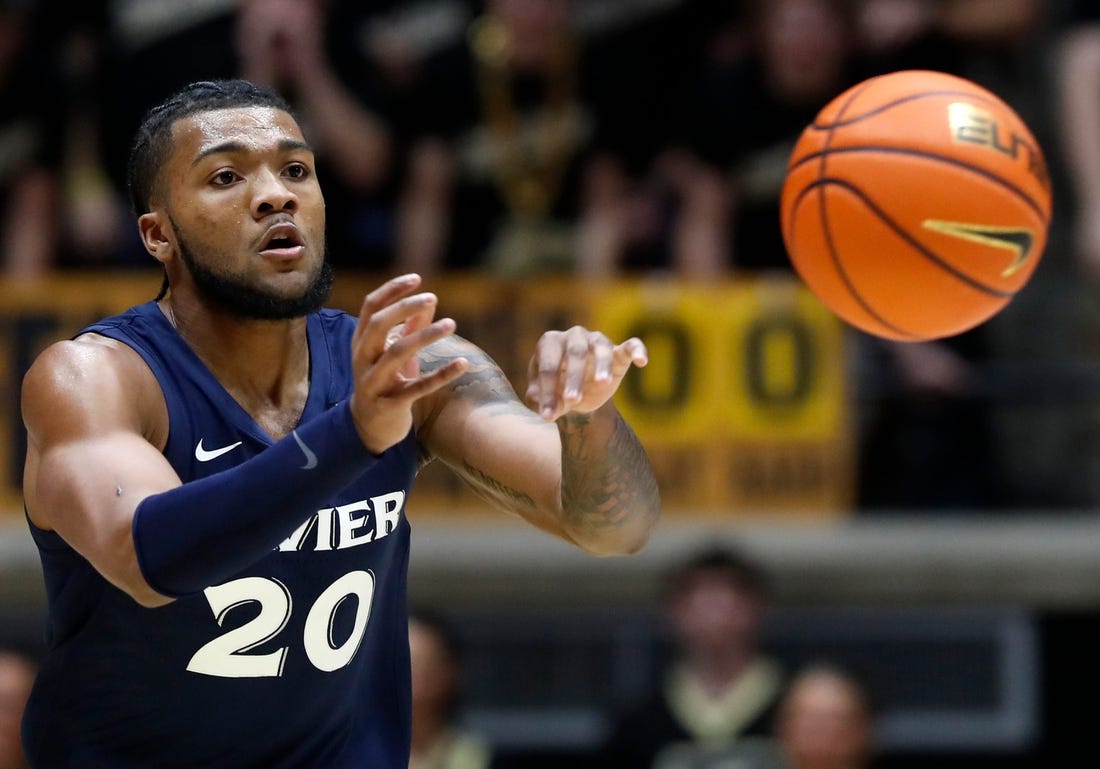 Xavier Musketeers guard Dayvion McKnight (20) passes the ball during the NCAA men   s basketball game against the Purdue Boilermakers, Monday, Nov. 13, 2023, at Mackey Arena in West Lafayette, Ind. Purdue Boilermakers won 83-71.