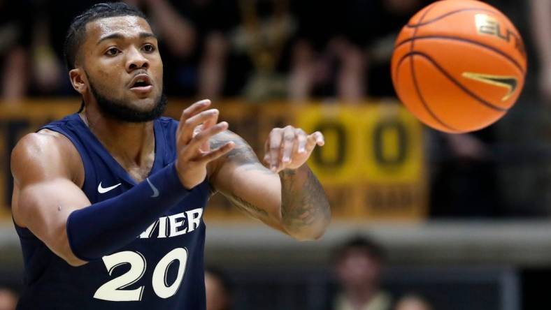 Xavier Musketeers guard Dayvion McKnight (20) passes the ball during the NCAA men   s basketball game against the Purdue Boilermakers, Monday, Nov. 13, 2023, at Mackey Arena in West Lafayette, Ind. Purdue Boilermakers won 83-71.