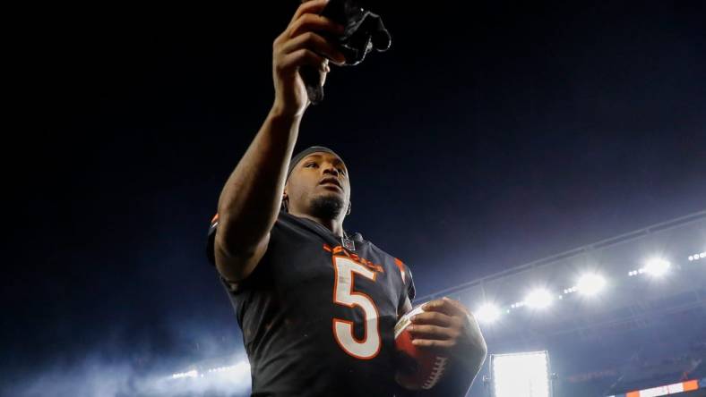 Nov 5, 2023; Cincinnati, Ohio, USA; Cincinnati Bengals wide receiver Tee Higgins (5) hands his gloves to fans after the victory over the Buffalo Bills at Paycor Stadium. Mandatory Credit: Katie Stratman-USA TODAY Sports