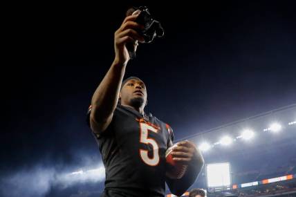 Nov 5, 2023; Cincinnati, Ohio, USA; Cincinnati Bengals wide receiver Tee Higgins (5) hands his gloves to fans after the victory over the Buffalo Bills at Paycor Stadium. Mandatory Credit: Katie Stratman-USA TODAY Sports