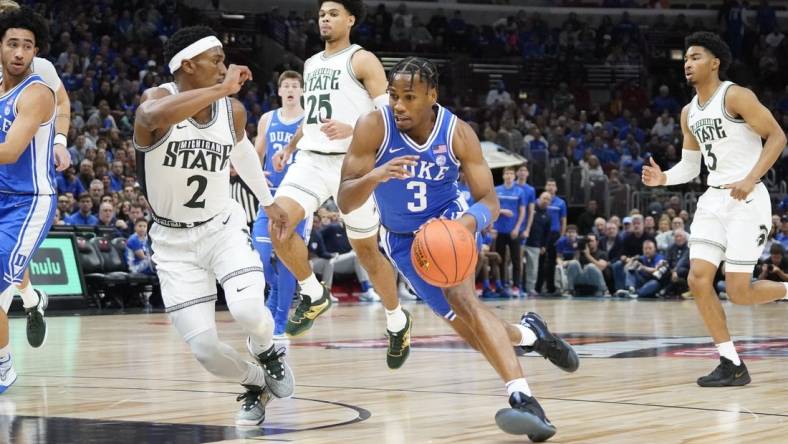 Nov 14, 2023; Chicago, Illinois, USA; Michigan State Spartans guard Tyson Walker (2) defends Duke Blue Devils guard Jeremy Roach (3) during the first half at United Center. Mandatory Credit: David Banks-USA TODAY Sports