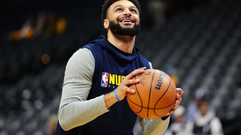 Nov 14, 2023; Denver, Colorado, USA; Denver Nuggets guard Jamal Murray (27) warms up before the game against the LA Clippers at Ball Arena. Mandatory Credit: Ron Chenoy-USA TODAY Sports