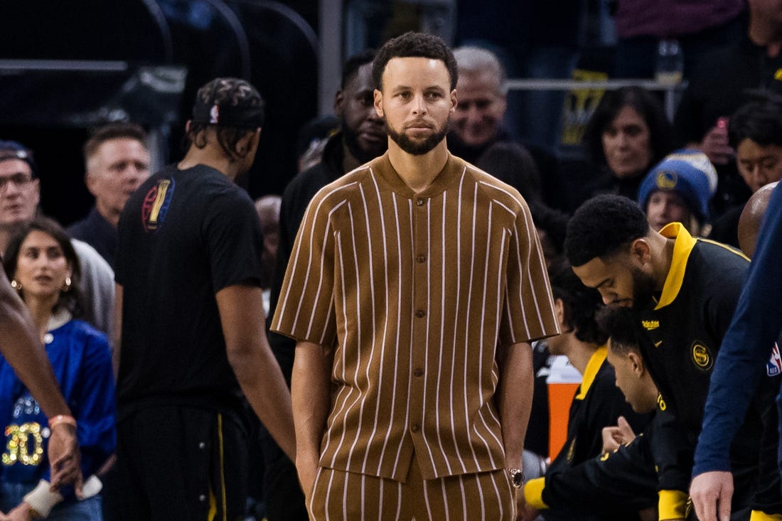 Nov 14, 2023; San Francisco, California, USA; Golden State Warriors guard Stephen Curry (30) watches the game against the Minnesota Timberwolvesx during the first half at Chase Center. Mandatory Credit: John Hefti-USA TODAY Sports