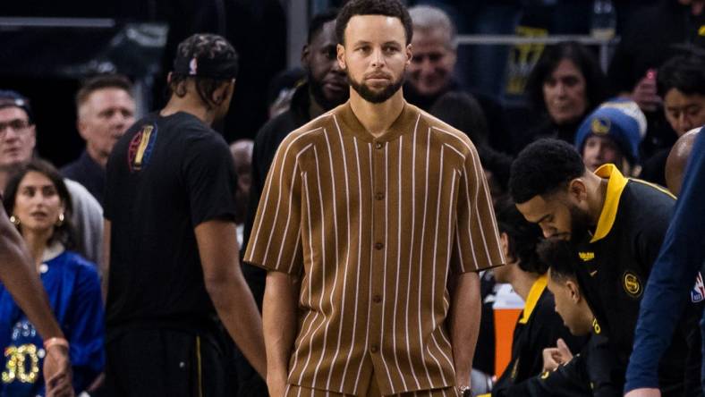 Nov 14, 2023; San Francisco, California, USA; Golden State Warriors guard Stephen Curry (30) watches the game against the Minnesota Timberwolvesx during the first half at Chase Center. Mandatory Credit: John Hefti-USA TODAY Sports