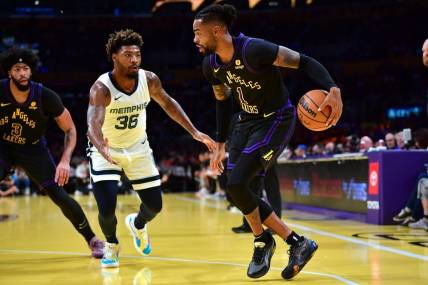 Nov 14, 2023; Los Angeles, California, USA; Los Angeles Lakers guard D   Angelo Russell (1) moves the ball against Memphis Grizzlies guard Marcus Smart (36) during the first half at Crypto.com Arena. Mandatory Credit: Gary A. Vasquez-USA TODAY Sports