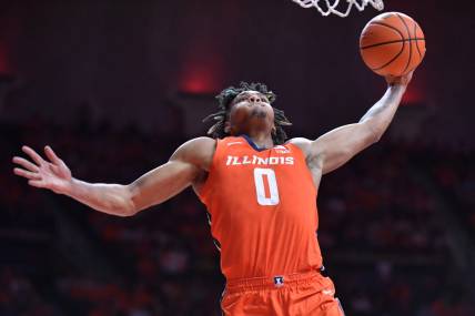 Nov 14, 2023; Champaign, Illinois, USA; Illinois Fighting Illini guard Terrence Shannon Jr. (0) dunks the ball during the first half against the Marquette Golden Eagles at State Farm Center. Mandatory Credit: Ron Johnson-USA TODAY Sports