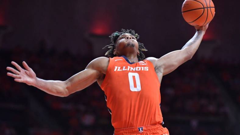 Nov 14, 2023; Champaign, Illinois, USA; Illinois Fighting Illini guard Terrence Shannon Jr. (0) dunks the ball during the first half against the Marquette Golden Eagles at State Farm Center. Mandatory Credit: Ron Johnson-USA TODAY Sports