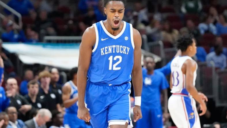 Nov 14, 2023; Chicago, Illinois, USA; Kentucky Wildcats guard Antonio Reeves (12) reacts after scoring against the Kansas Jayhawks during the second half at United Center. Mandatory Credit: David Banks-USA TODAY Sports