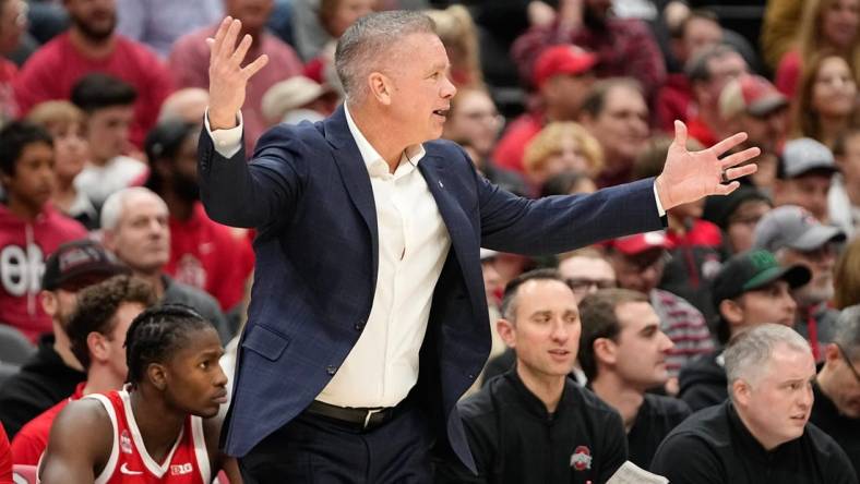 Nov 15, 2023; Columbus, OH, USA; Ohio State Buckeyes head coach Chris Holtmann reacts during the second half of the NCAA men   s basketball game against the Merrimack College Warriors at Value City Arena. Ohio State won 76-52.