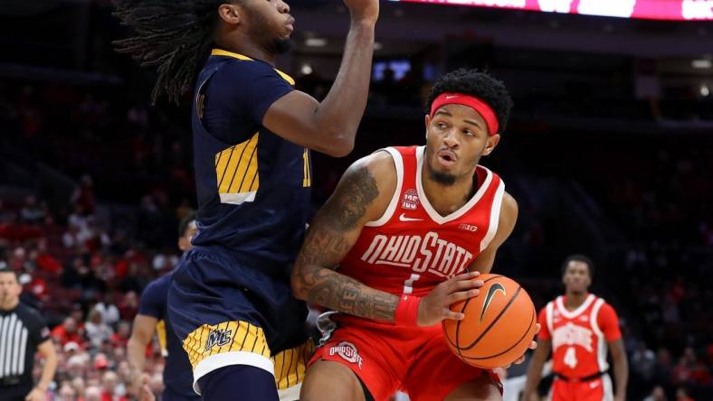 Nov 15, 2023; Columbus, Ohio, USA;  Ohio State Buckeyes guard Roddy Gayle Jr. (1) looks for space to dribble as Merrimack College Warriors forward Bryan Etumnu (11)defends during the second half at Value City Arena. Mandatory Credit: Joseph Maiorana-USA TODAY Sports