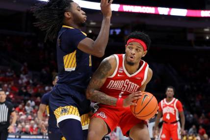 Nov 15, 2023; Columbus, Ohio, USA;  Ohio State Buckeyes guard Roddy Gayle Jr. (1) looks for space to dribble as Merrimack College Warriors forward Bryan Etumnu (11)defends during the second half at Value City Arena. Mandatory Credit: Joseph Maiorana-USA TODAY Sports