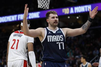 Nov 15, 2023; Washington, District of Columbia, USA; Dallas Mavericks guard Luka Doncic (77) gestures after scoring against the Washington Wizards in the second quarter at Capital One Arena. Mandatory Credit: Geoff Burke-USA TODAY Sports