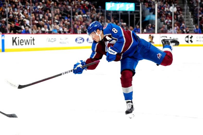 Nov 15, 2023; Denver, Colorado, USA; Colorado Avalanche defenseman Cale Makar (8) shoots the puck in the second period against the Anaheim Ducks at Ball Arena. Mandatory Credit: Ron Chenoy-USA TODAY Sports