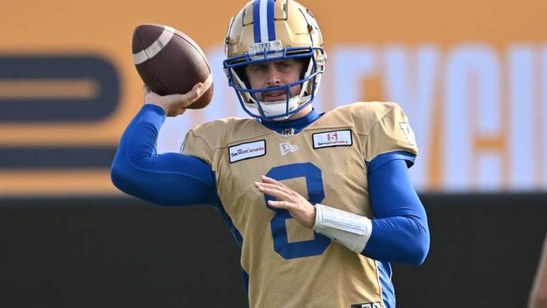 Nov 16, 2023; Hamilton, Ontario, CAN;  Winnipeg Blue Bombers quarterback Zach Collaros (8) throws a pass during practice at Tim Hortons Field. Mandatory Credit: Dan Hamilton-USA TODAY Sports