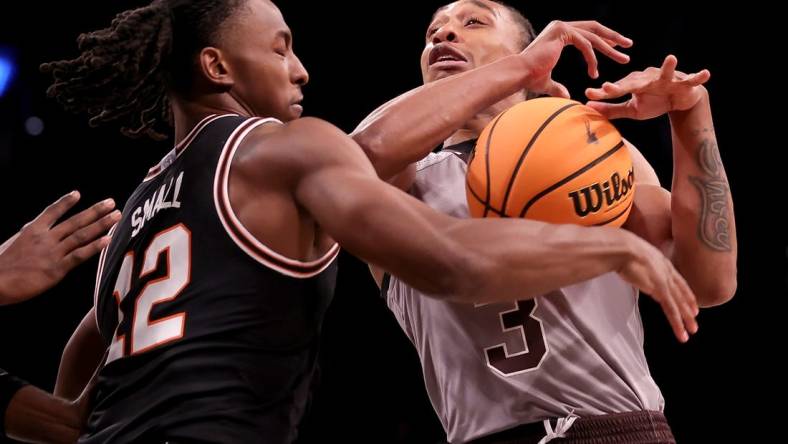 Nov 16, 2023; Brooklyn, New York, USA; Oklahoma State Cowboys guard Javon Small (12) strips the ball from St. Bonaventure Bonnies guard Mika Adams-Woods (3) during the first half at Barclays Center. Mandatory Credit: Brad Penner-USA TODAY Sports