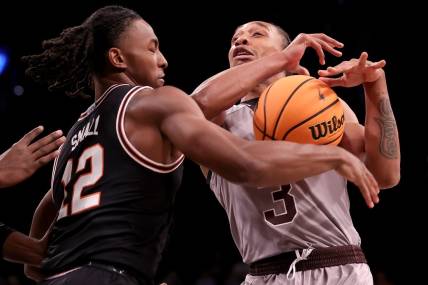 Nov 16, 2023; Brooklyn, New York, USA; Oklahoma State Cowboys guard Javon Small (12) strips the ball from St. Bonaventure Bonnies guard Mika Adams-Woods (3) during the first half at Barclays Center. Mandatory Credit: Brad Penner-USA TODAY Sports
