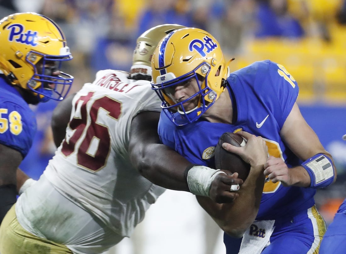 Nov 16, 2023; Pittsburgh, Pennsylvania, USA; Pittsburgh Panthers quarterback Nate Yarnell (19) carries the ball against Boston College Eagles defensive tackle Cam Horsley (96) during the second quarter at Acrisure Stadium. Mandatory Credit: Charles LeClaire-USA TODAY Sports