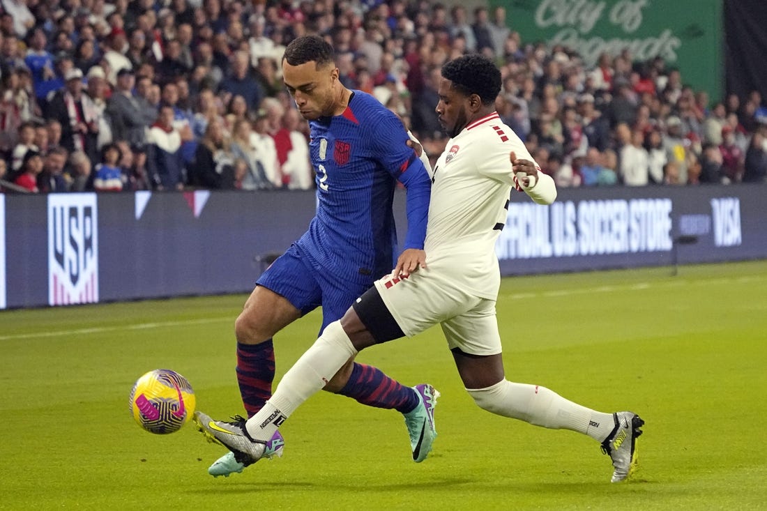 Nov 16, 2023; Austin, Texas, USA; U.S. Men's National team defender Sergino Dest (2) and Trinidad and Tobago defender Andre Raymond (6) battle for the ball during the first half in the Concacaf Quarterfinal at Q2 Stadium. Mandatory Credit: Scott Wachter-USA TODAY Sports