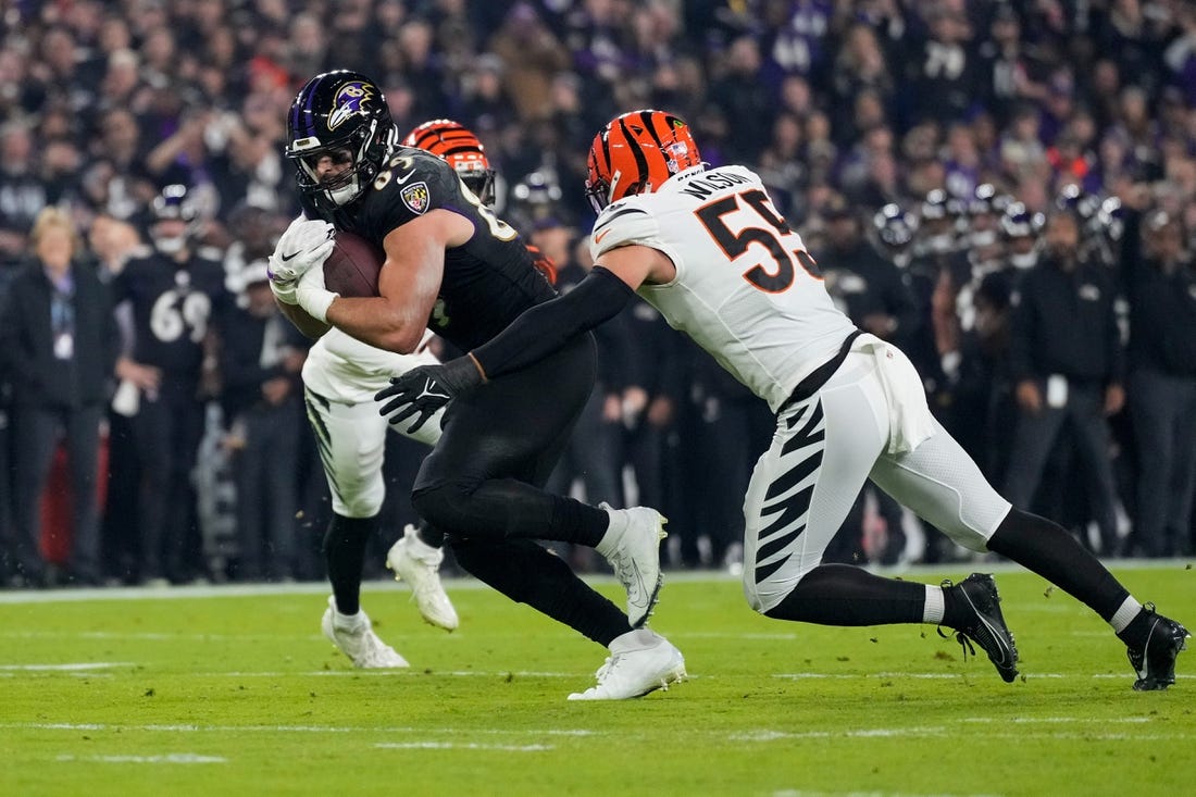 Baltimore Ravens tight end Mark Andrews (89) fights a tackle from Cincinnati Bengals linebacker Logan Wilson (55) in the first quarter of the NFL Week 11 game between the Baltimore Ravens and the Cincinnati Bengals at M&T Bank Stadium in Baltimore on Thursday, Nov. 16, 2023.