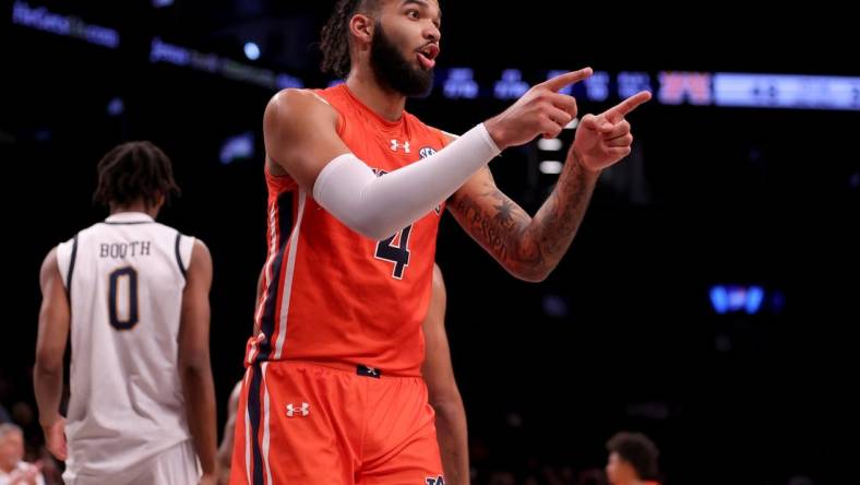 Nov 16, 2023; Brooklyn, New York, USA; Auburn Tigers forward Johni Broome (4) reacts during the second half against the Notre Dame Fighting Irish at Barclays Center. Mandatory Credit: Brad Penner-USA TODAY Sports