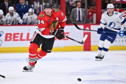 Nov 16, 2023; Chicago, Illinois, USA; Chicago Blackhawks forward Corey Perry (94) chases after a loose puck in the third period against the Tampa Bay Lightning at United Center. Mandatory Credit: Jamie Sabau-USA TODAY Sports