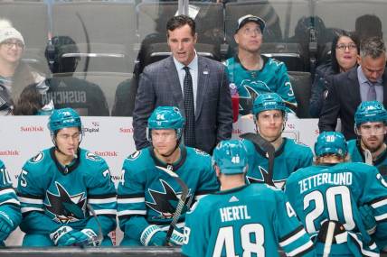 Nov 16, 2023; San Jose, California, USA; San Jose Sharks head coach David Quinn watches the game from the bench against the St. Louis Blues during the third period at SAP Center at San Jose. Mandatory Credit: Robert Edwards-USA TODAY Sports