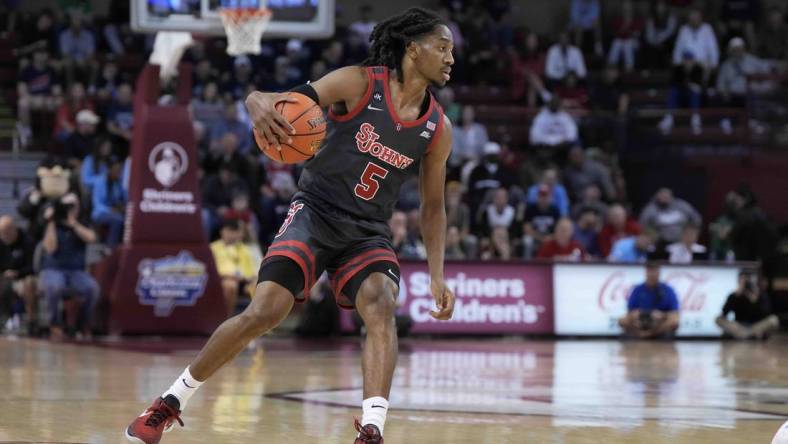 Nov 17, 2023; Charleston, SC, USA; St. John's Red Storm guard Daniss Jenkins (5) drives the ball in the first half against the Dayton Flyers at TD Arena. Mandatory Credit: David Yeazell-USA TODAY Sports