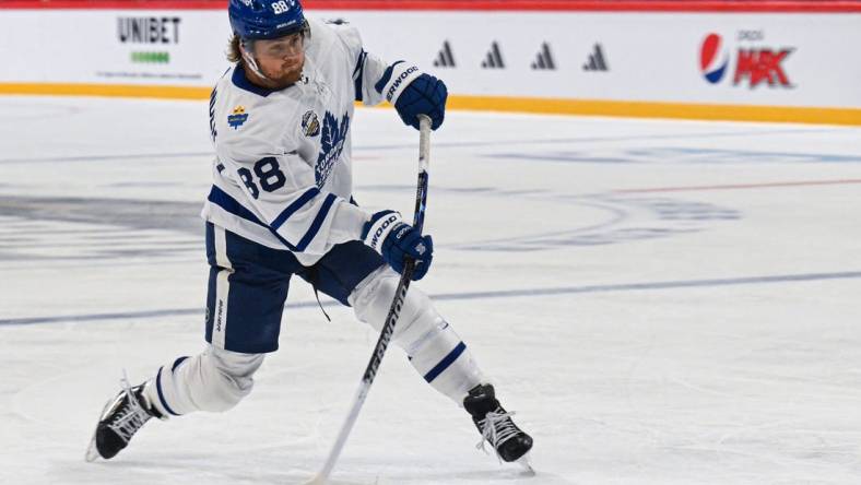 Nov 17, 2023; Stockholm, SWE; Toronto Maple Leafs right wing William Nylander (88) takes a shot against the Detroit Red Wings during a Global Series NHL hockey game at Avicii Arena. Mandatory Credit: Per Haljestam-USA TODAY Sports