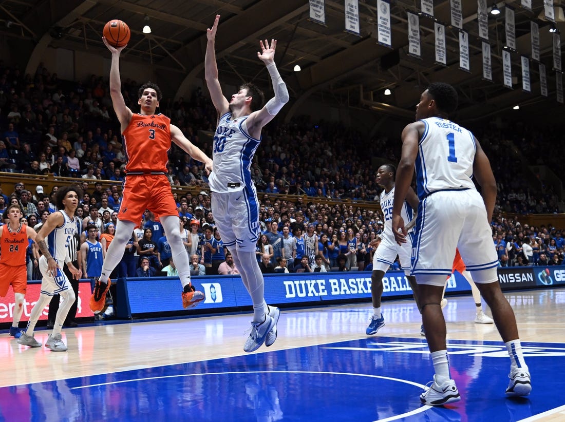 Nov 17, 2023; Durham, North Carolina, USA; Bucknell Bison forward Brady Muller (3) shoots over Duke Blue Devils center Kyle Filipowski(30) during the first half at Cameron Indoor Stadium. Mandatory Credit: Rob Kinnan-USA TODAY Sports