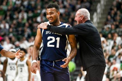 Butler's Pierre Brooks II, left, and head coach Thad Matta laugh after Brooks was called for a technical foul after celebrating his dunk against Michigan State during the first half on Friday, Nov. 17, 2023, in East Lansing.