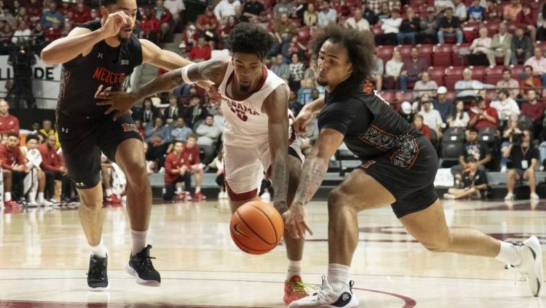 Nov 17, 2023; Tuscaloosa, Alabama, USA;  Alabama guard Aaron Estrada splits between Mercer forward TJ Grant (14) and Mercer guard Jah Quinones (0) at Coleman Coliseum. Mandatory Credit: Gary Cosby Jr.-USA TODAY Sports