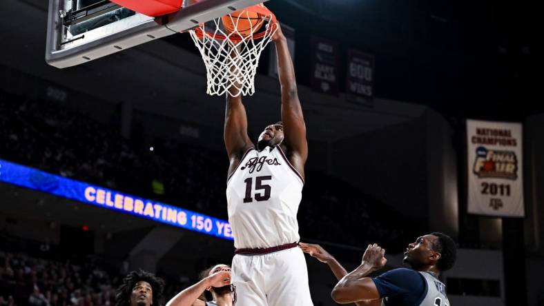 Nov 17, 2023; College Station, Texas, USA;  Texas A&M Aggies forward Henry Coleman III (15) dunks the ball during the first half against the Oral Roberts Golden Eagles at Reed Arena. Mandatory Credit: Maria Lysaker-USA TODAY Sports