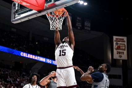 Nov 17, 2023; College Station, Texas, USA;  Texas A&M Aggies forward Henry Coleman III (15) dunks the ball during the first half against the Oral Roberts Golden Eagles at Reed Arena. Mandatory Credit: Maria Lysaker-USA TODAY Sports