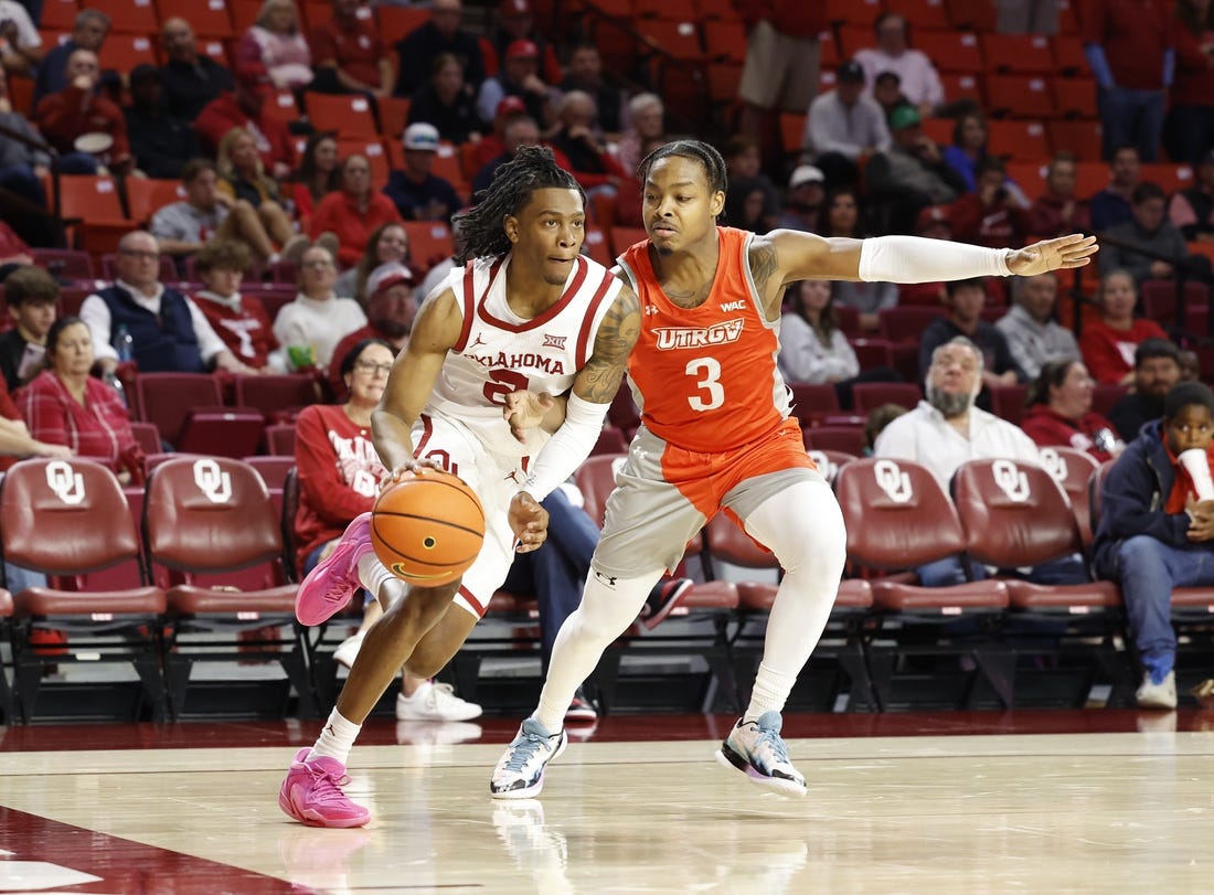 Nov 17, 2023; Norman, Oklahoma, USA; Oklahoma Sooners guard Javian McCollum (2) drives around UT Rio Grande Valley Vaqueros guard DeAnthony Tipler Jr. (3) during the second half at Lloyd Noble Center. Mandatory Credit: Alonzo Adams-USA TODAY Sports