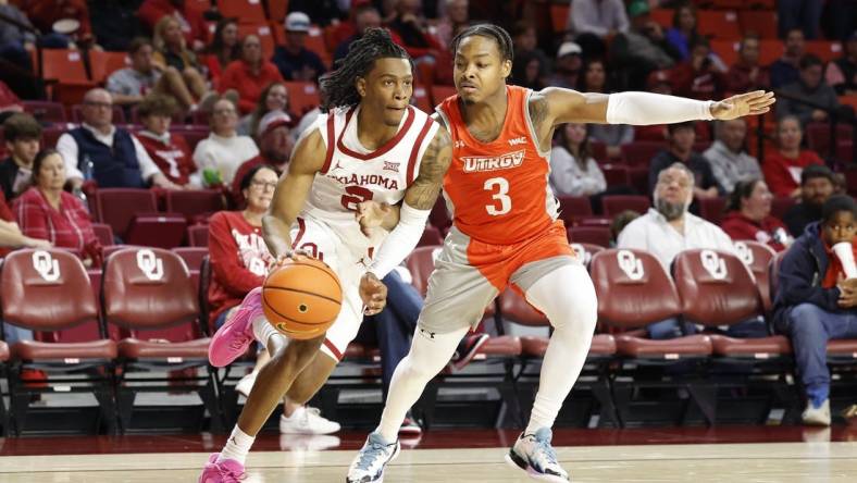 Nov 17, 2023; Norman, Oklahoma, USA; Oklahoma Sooners guard Javian McCollum (2) drives around UT Rio Grande Valley Vaqueros guard DeAnthony Tipler Jr. (3) during the second half at Lloyd Noble Center. Mandatory Credit: Alonzo Adams-USA TODAY Sports