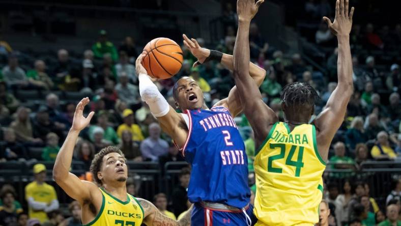 Oregon center Mahamadou Diawara fouls Tennessee State guard Christian Brown as the Oregon Ducks host Tennessee State Friday, Nov. 17, 2023, at Matthew Knight Arena in Eugene, Ore.