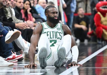 Nov 17, 2023; Toronto, Ontario, CAN; Boston Celtics guard Jaylen Brown (7) reacts after falling during play against the Toronto Raptors in the second  half at Scotiabank Arena. Mandatory Credit: Dan Hamilton-USA TODAY Sports