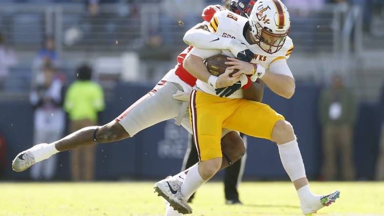 Nov 18, 2023; Oxford, Mississippi, USA; Louisiana Monroe Warhawks quarterback Jiya Wright (18) runs the ball as Mississippi Rebels defensive back Ladarius Tennison (13) makes the tackle during the first half at Vaught-Hemingway Stadium. Mandatory Credit: Petre Thomas-USA TODAY Sports