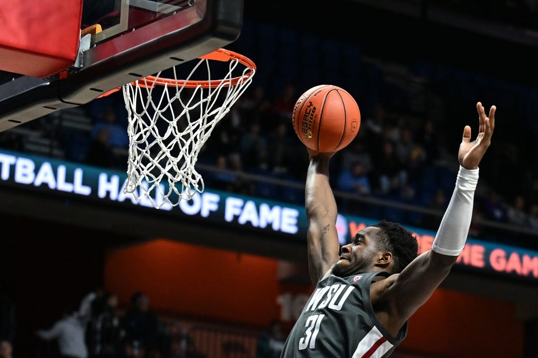 Nov 18, 2023; Uncasville, CT, USA; Washington State Cougars guard Kymany Houinsou (31) rebounds the ball during the second half against Mississippi State Bulldogs at Mohegan Sun Arena. Mandatory Credit: Mark Smith-USA TODAY Sports