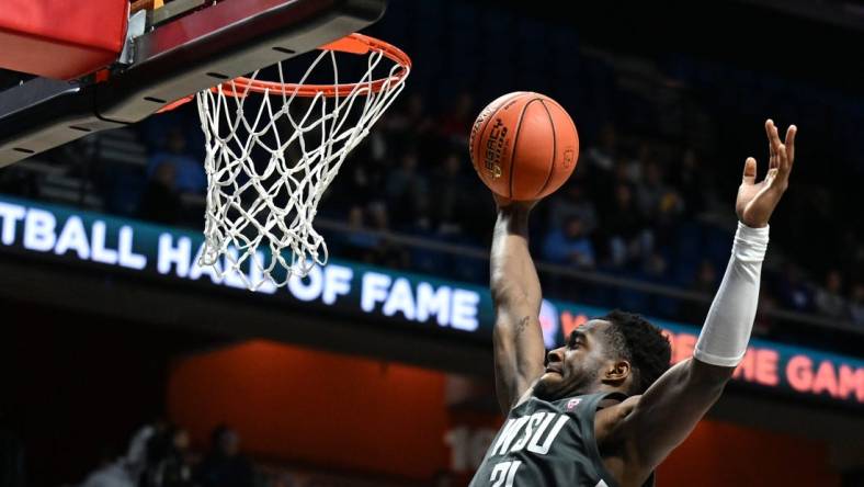 Nov 18, 2023; Uncasville, CT, USA; Washington State Cougars guard Kymany Houinsou (31) rebounds the ball during the second half against Mississippi State Bulldogs at Mohegan Sun Arena. Mandatory Credit: Mark Smith-USA TODAY Sports