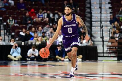Nov 18, 2023; Uncasville, Connecticut, USA; Northwestern Wildcats guard Boo Buie (0) dribbles the ball against the Rhode Island Rams during the second half at Mohegan Sun Arena. Mandatory Credit: Mark Smith-USA TODAY Sports